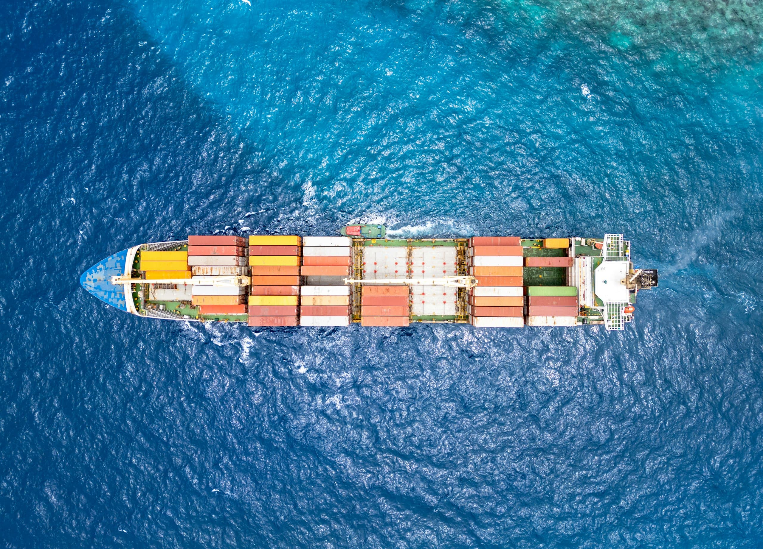 Aerial view of a container ship under way in open ocean